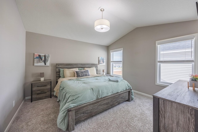 4329 141st Ln NW, Andover, MN 55304 - bedroom with light colored carpet, lofted ceiling, and baseboards