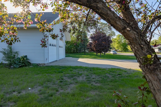 101 6th St NW, Perham, MN 56573 - view of green lawn with concrete driveway and a garage
