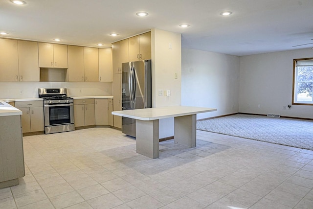101 6th St NW, Perham, MN 56573 - kitchen featuring appliances with stainless steel finishes, light countertops, recessed lighting, open floor plan, and baseboards