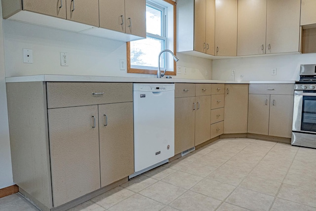 101 6th St NW, Perham, MN 56573 - kitchen featuring white dishwasher, stainless steel gas stove, and light countertops