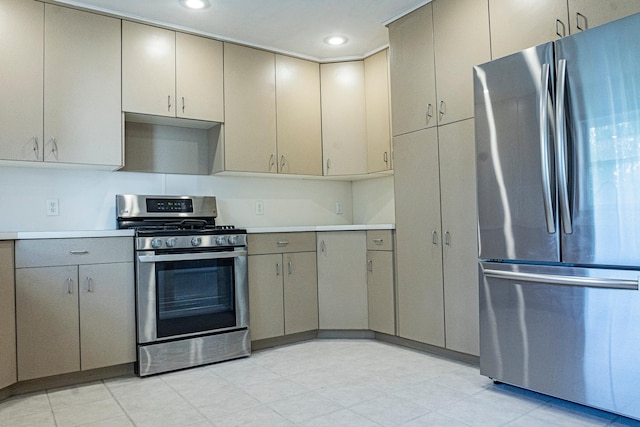 101 6th St NW, Perham, MN 56573 - kitchen featuring stainless steel appliances, gray cabinetry, light countertops, recessed lighting, and cream cabinetry