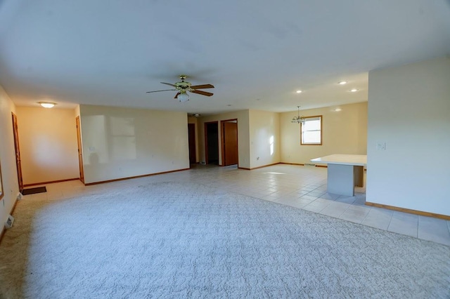 101 6th St NW, Perham, MN 56573 - unfurnished room with light tile patterned floors, baseboards, light colored carpet, a ceiling fan, and recessed lighting