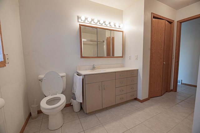 101 6th St NW, Perham, MN 56573 - bathroom featuring toilet, baseboards, tile patterned floors, and vanity