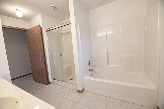 101 6th St NW, Perham, MN 56573 - full bath featuring a shower with shower door, tile patterned flooring, a tub, and vanity