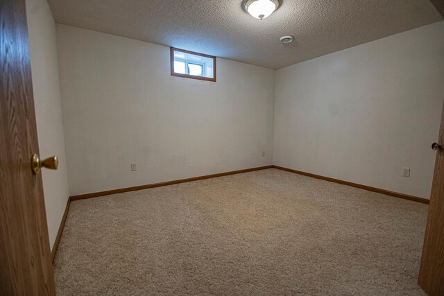 101 6th St NW, Perham, MN 56573 - below grade area with carpet flooring, a textured ceiling, and baseboards