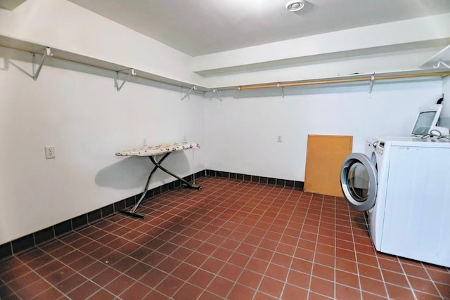 101 6th St NW, Perham, MN 56573 - washroom with washer and clothes dryer and tile patterned floors
