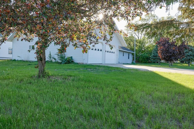 101 6th St NW, Perham, MN 56573 - view of property exterior featuring a yard and concrete driveway