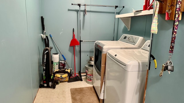 25673 Happy Hollow Rd, Park Rapids, MN 56470 - laundry area with washer and clothes dryer and tile patterned floors
