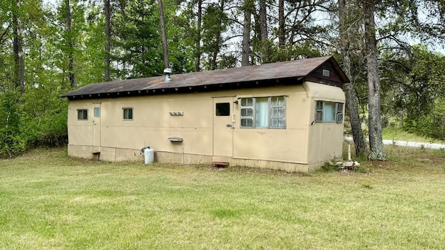 25673 Happy Hollow Rd, Park Rapids, MN 56470 - view of home's exterior featuring a yard, a shingled roof, and crawl space