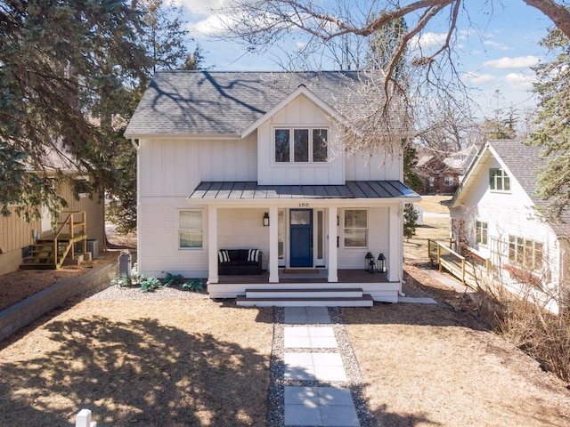 168 1st St, Excelsior, MN 55331 - modern farmhouse style home featuring a standing seam roof, a shingled roof, board and batten siding, covered porch, and metal roof