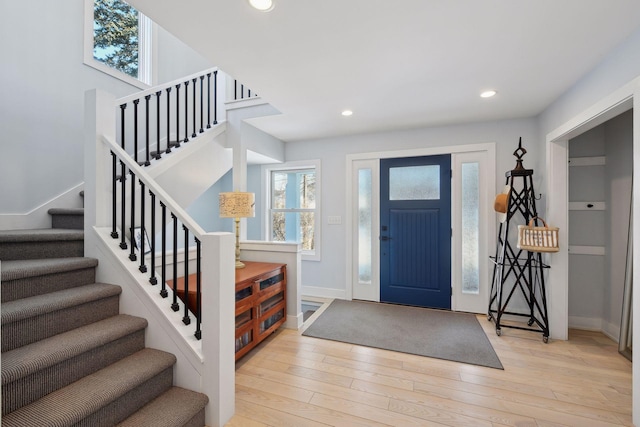 168 1st St, Excelsior, MN 55331 - foyer featuring stairway, light wood-style floors, baseboards, and recessed lighting