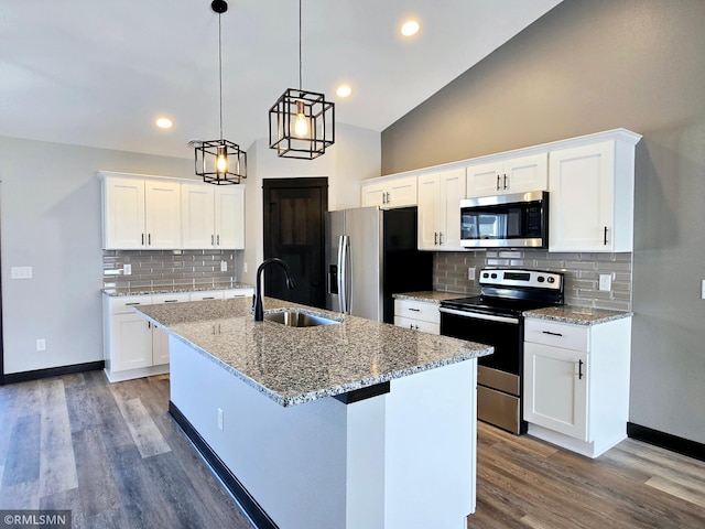 90 Balsam Ln, Madison Lake, MN 56063 - kitchen with stainless steel appliances, a sink, tasteful backsplash, a center island with sink, and wood finished floors