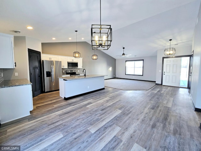 90 Balsam Ln, Madison Lake, MN 56063 - kitchen with stainless steel appliances, a chandelier, vaulted ceiling, white cabinets, and ceiling fan