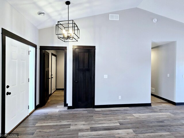 90 Balsam Ln, Madison Lake, MN 56063 - foyer entrance featuring a chandelier, vaulted ceiling, wood finished floors, and baseboards