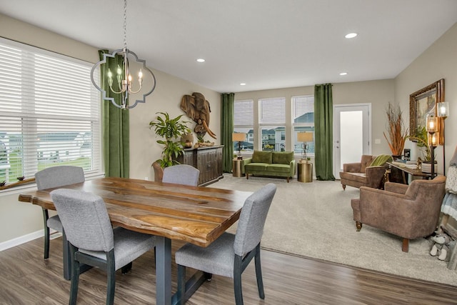20555 Greenwood Ave, Lakeville, MN 55044 - dining area with a chandelier, wood finished floors, recessed lighting, and baseboards