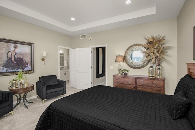 20555 Greenwood Ave, Lakeville, MN 55044 - bedroom with light colored carpet, a tray ceiling, recessed lighting, baseboards, and connected bathroom