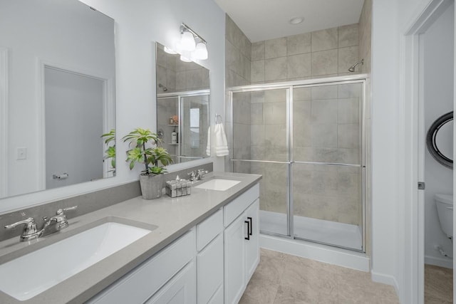 20555 Greenwood Ave, Lakeville, MN 55044 - bathroom featuring a shower stall, double vanity, and toilet