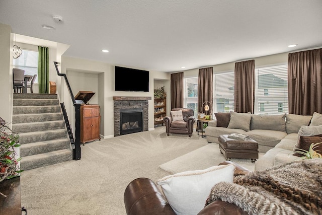 20555 Greenwood Ave, Lakeville, MN 55044 - carpeted living room featuring stairway, a stone fireplace, and recessed lighting