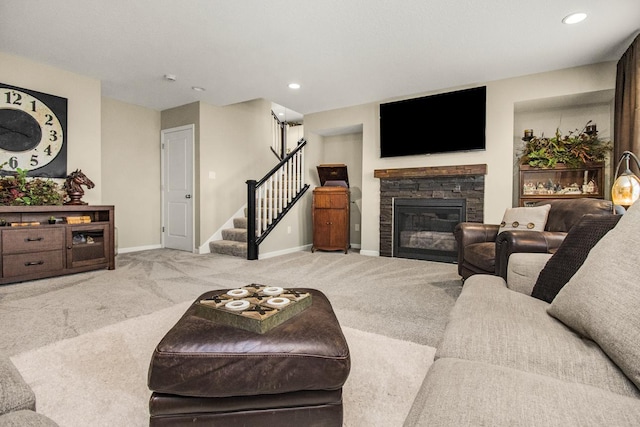 20555 Greenwood Ave, Lakeville, MN 55044 - carpeted living area featuring stairway, baseboards, a stone fireplace, and recessed lighting