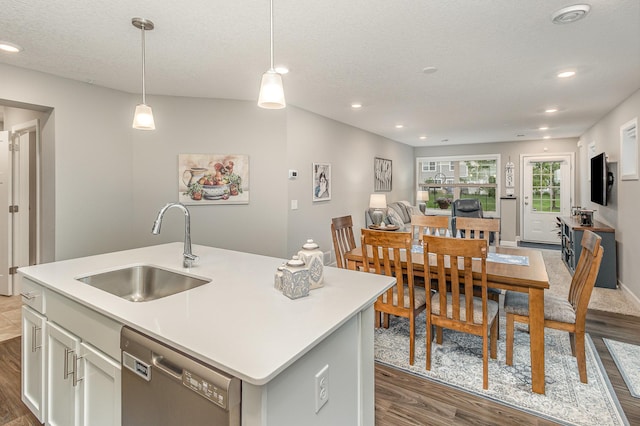 1259 Lower 143rd St E, Rosemount, MN 55068 - kitchen featuring stainless steel dishwasher, a sink, dark wood finished floors, light countertops, and recessed lighting