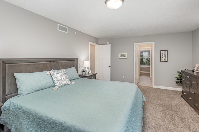 1259 Lower 143rd St E, Rosemount, MN 55068 - bedroom with light carpet, baseboards, and ensuite bath