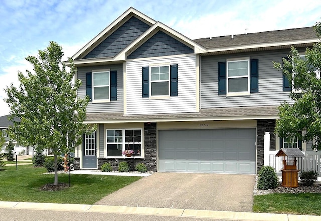 1259 Lower 143rd St E, Rosemount, MN 55068 - view of front of home with driveway, stone siding, and an attached garage