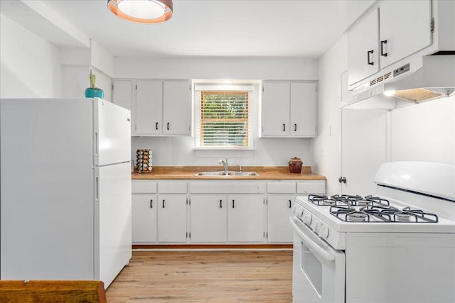 180 Saint Croix Trl N, Lakeland, MN 55043 - kitchen with white appliances, a sink, under cabinet range hood, light wood-style floors, and white cabinets