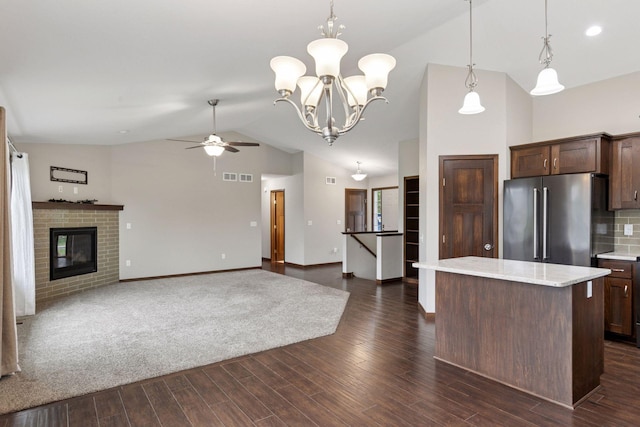 1429 10th Street Cir SE, New Prague, MN 56071 - kitchen with high quality fridge, light countertops, a ceiling fan, hanging light fixtures, and dark brown cabinets