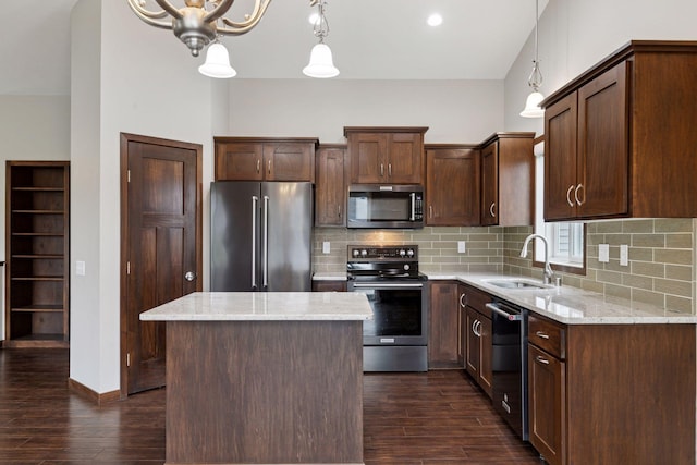 1429 10th Street Cir SE, New Prague, MN 56071 - kitchen with appliances with stainless steel finishes, a sink, dark wood-type flooring, and tasteful backsplash
