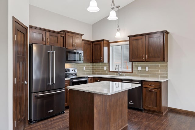 1429 10th Street Cir SE, New Prague, MN 56071 - kitchen with appliances with stainless steel finishes, a sink, dark wood-style flooring, backsplash, and high vaulted ceiling