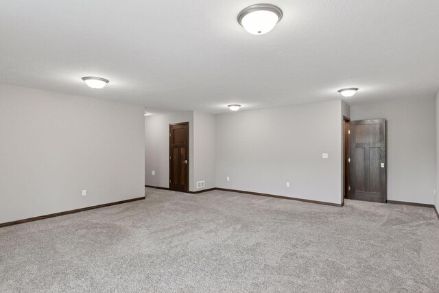 1429 10th Street Cir SE, New Prague, MN 56071 - empty room featuring light carpet and baseboards