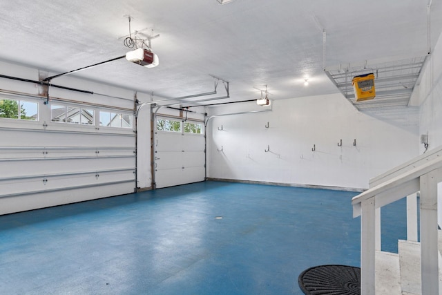 1429 10th Street Cir SE, New Prague, MN 56071 - garage featuring a garage door opener
