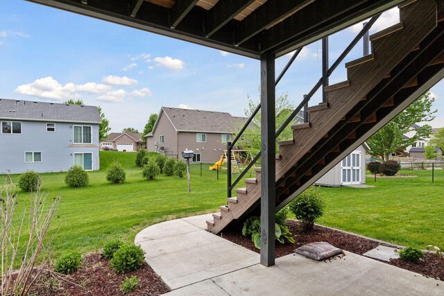 1429 10th Street Cir SE, New Prague, MN 56071 - view of yard with stairs, a residential view, a patio, and a playground