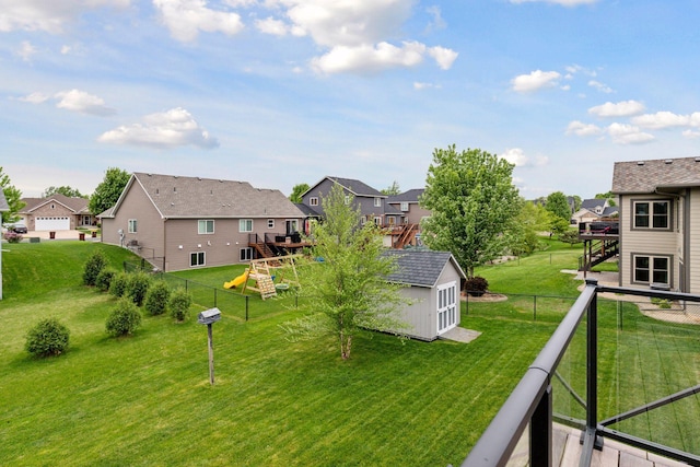 1429 10th Street Cir SE, New Prague, MN 56071 - view of yard with a residential view, a playground, stairs, and a wooden deck