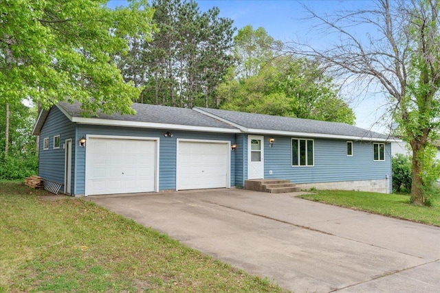447 Timberlane Dr, Somerset, WI 54025 - ranch-style home with an attached garage, concrete driveway, and a front lawn
