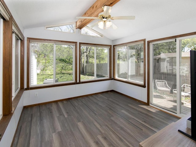 unfurnished sunroom featuring healthy amount of natural light, wood finished floors, and baseboards