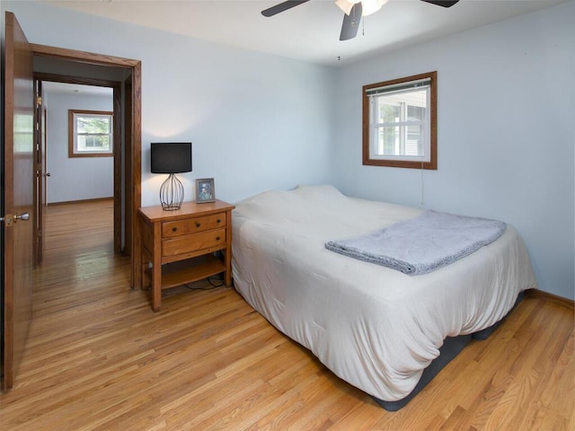 bedroom featuring light wood-style flooring and ceiling fan