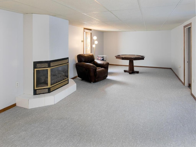 living area featuring carpet floors and baseboards