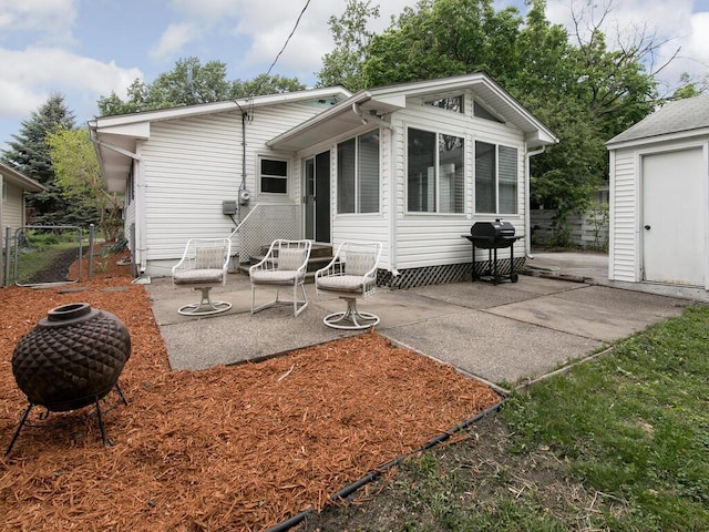 back of property featuring a patio area