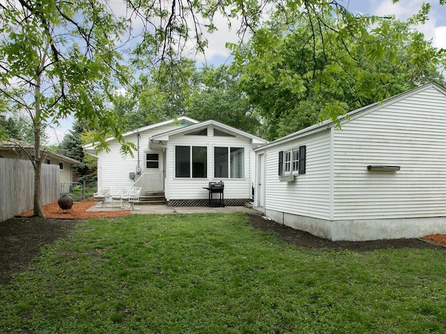 back of property featuring entry steps and a patio