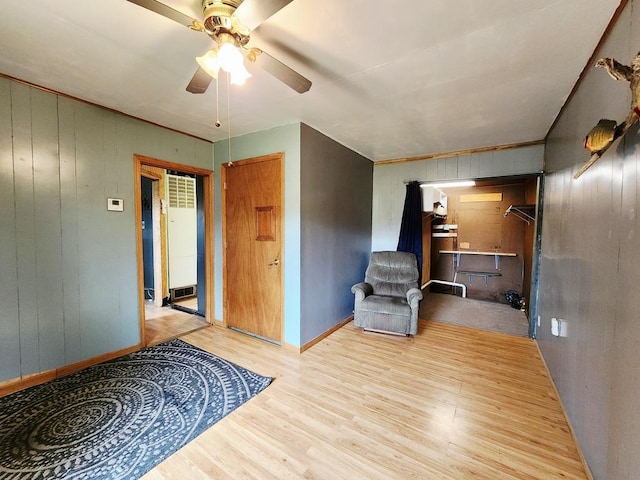 200 Jessie St, Marble, MN 55764 - unfurnished room with wood finished floors, a ceiling fan, baseboards, and wooden walls