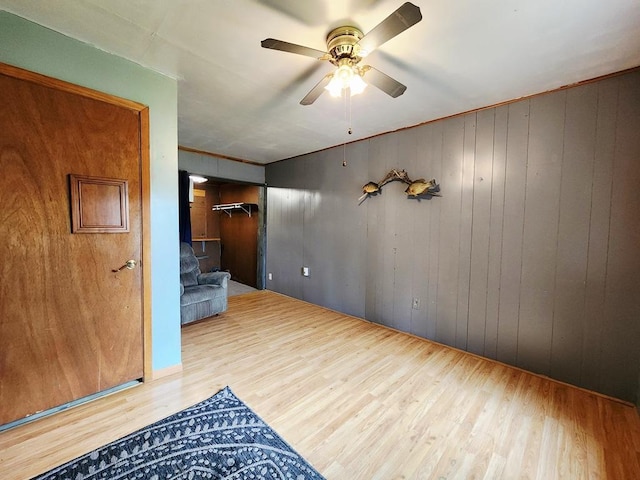 200 Jessie St, Marble, MN 55764 - empty room with wood finished floors, a ceiling fan, and wooden walls