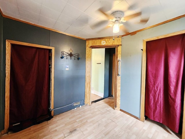 200 Jessie St, Marble, MN 55764 - unfurnished room with ornamental molding, a ceiling fan, wood finished floors, and baseboards