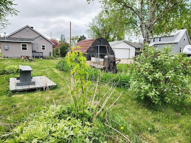 200 Jessie St, Marble, MN 55764 - view of yard with an outdoor structure, a detached garage, and a deck
