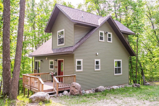8586 Graves Lake Rd NE, Remer, MN 56672 - view of front facade with roof with shingles and a wooden deck