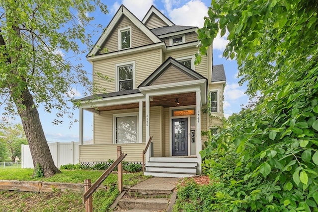 2744 Stevens Ave, Minneapolis, MN 55408 - view of front facade featuring a porch and a shingled roof
