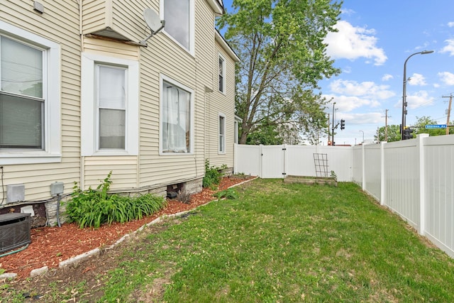 2744 Stevens Ave, Minneapolis, MN 55408 - view of yard with cooling unit and a gate