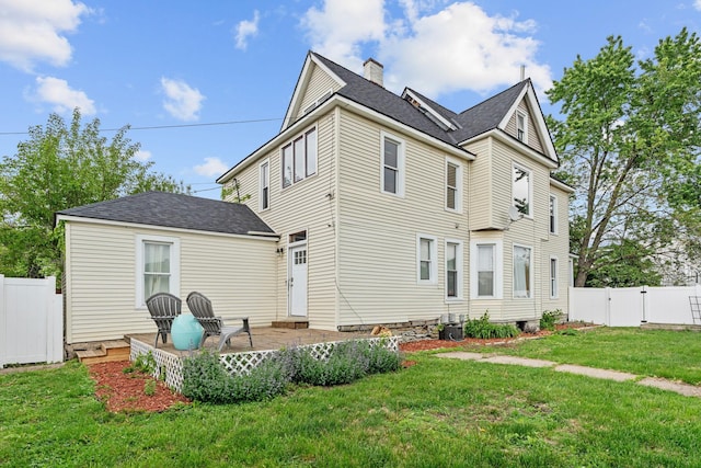 2744 Stevens Ave, Minneapolis, MN 55408 - view of property exterior with a patio area, a chimney, a gate, and a shingled roof