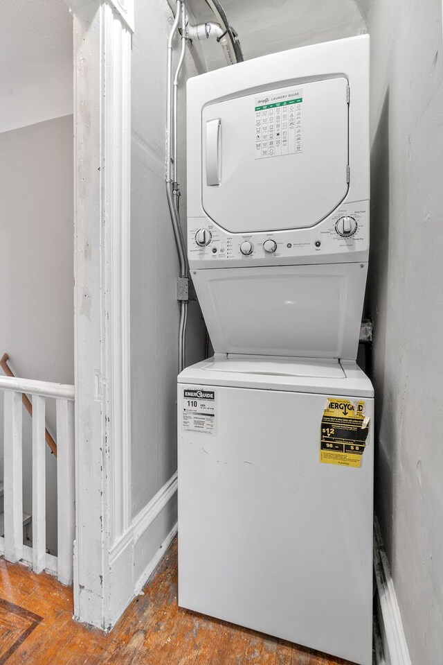2744 Stevens Ave, Minneapolis, MN 55408 - laundry area with stacked washer / dryer and wood finished floors