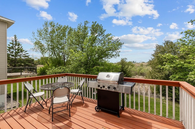 1610 Prescott Ln, Chaska, MN 55318 - wooden terrace featuring outdoor dining area, a lawn, and a grill